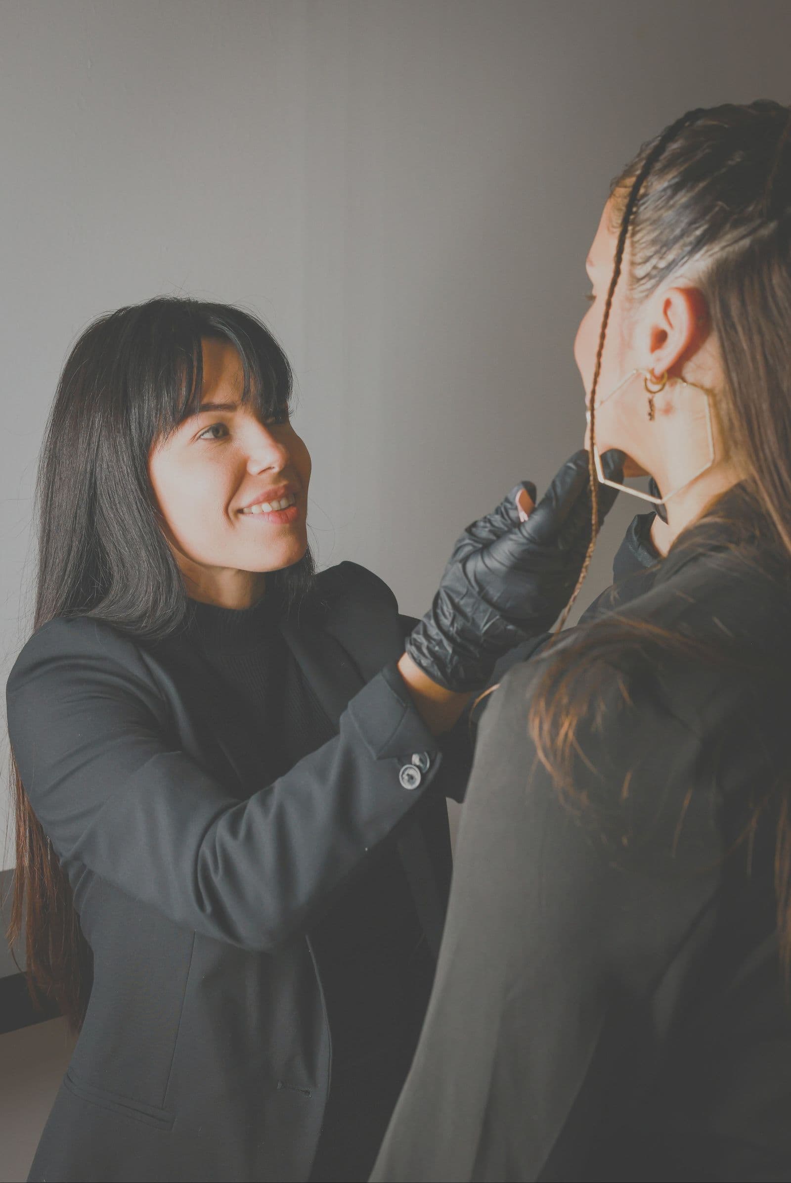 A colourist consulting with a client in natural light