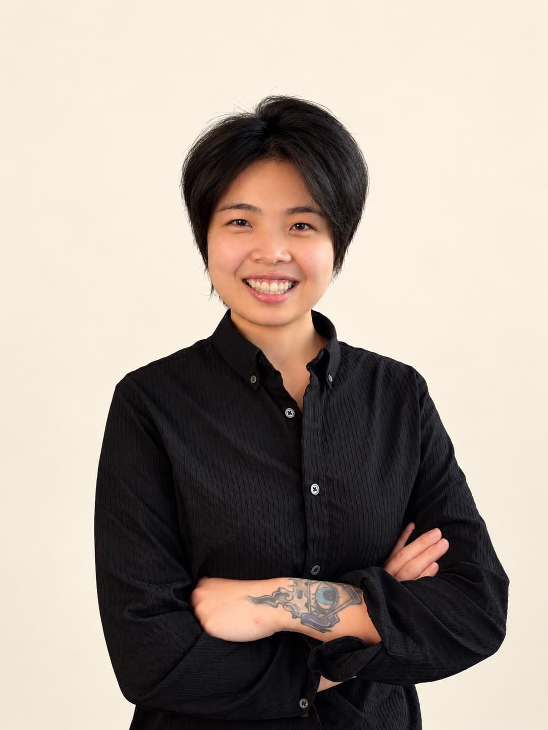 Portrait of Rain, senior stylist at Megas Hair Salon, Coquitlam