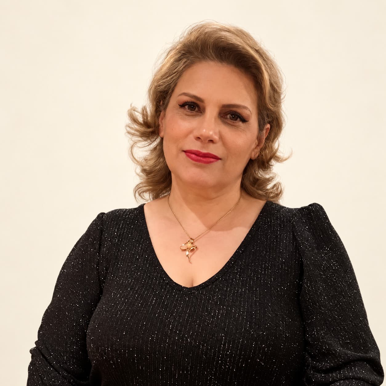 Portrait of Sima, senior stylist at Megas Hair Salon, Coquitlam