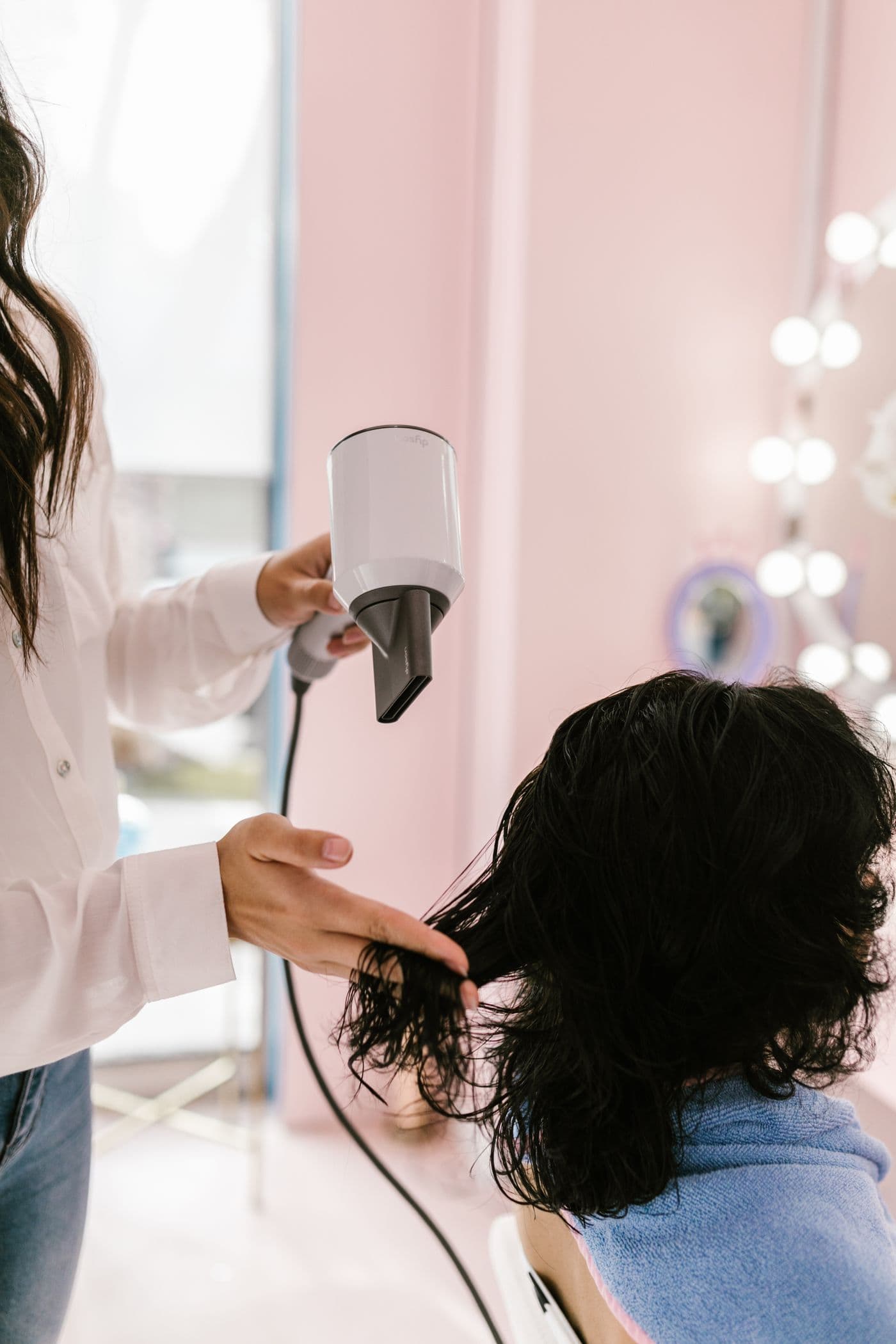 Glossy finished blowout with volume and movement, Megas Hair Salon Coquitlam