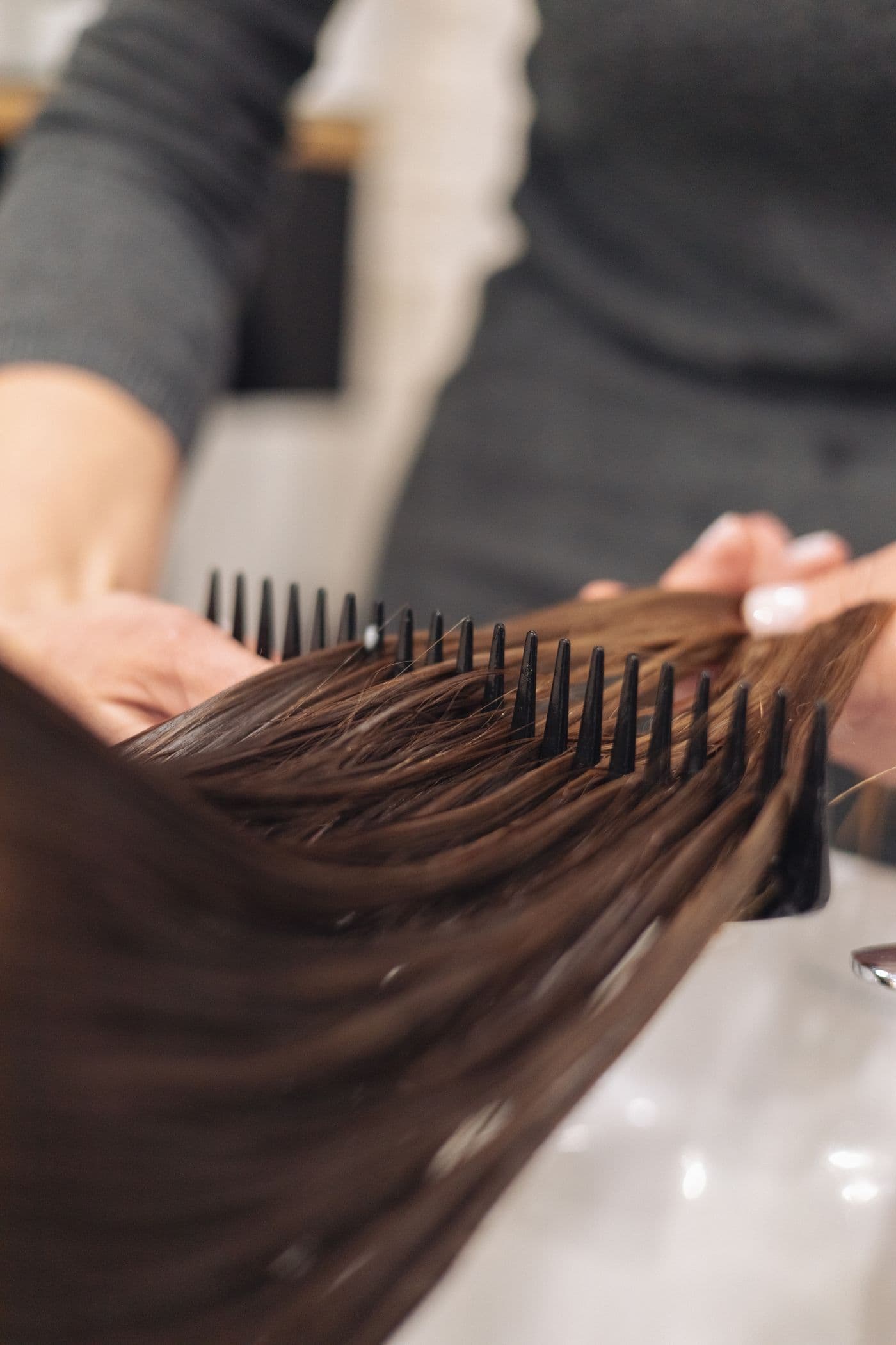 Smooth, glossy finish after keratin smoothing at Megas Hair Salon, Coquitlam